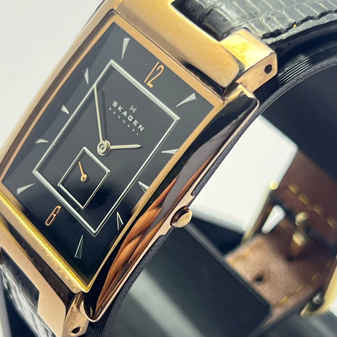 Đồng hồ Skagen Denmark mặt chữ nhật đen rose gold – dây da quartz tối giản